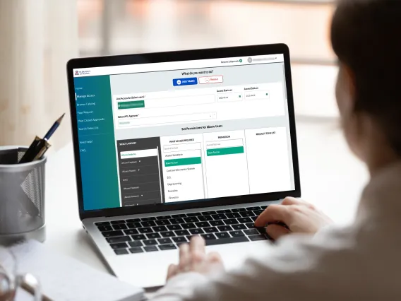 A person on their laptop filling out a provisioning request